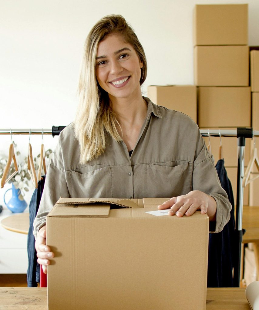 pexels-photo-7289733-7289733 Woman managing online store packaging for small business indoors.